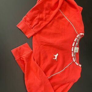Pink size medium in red sweater